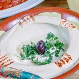 The breakfast table: shakshuka, foul, hummus, manakish and fruit