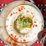Breakfast spread: labneh, halloumi, foul, fatteh, eggs and mezze