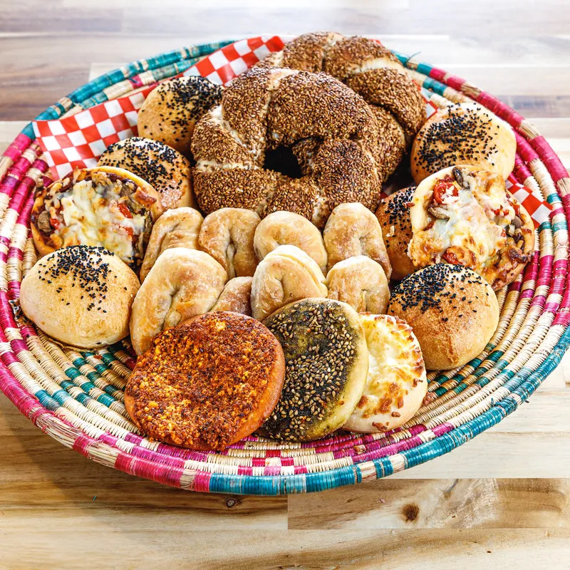 A basket of fresh-baked breads and pastries