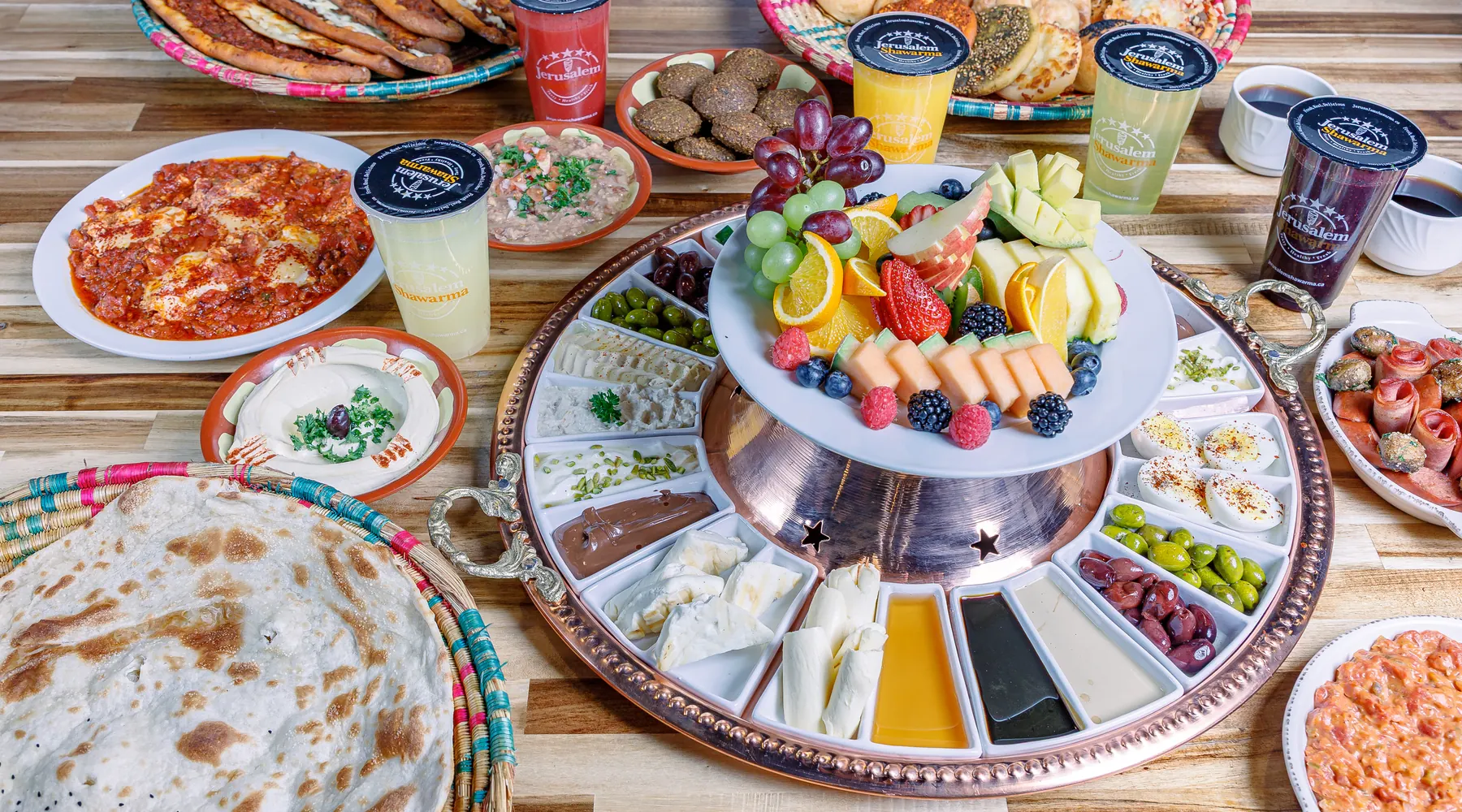 The weekend breakfast tray: dips, eggs, fruit, bread and fresh juice